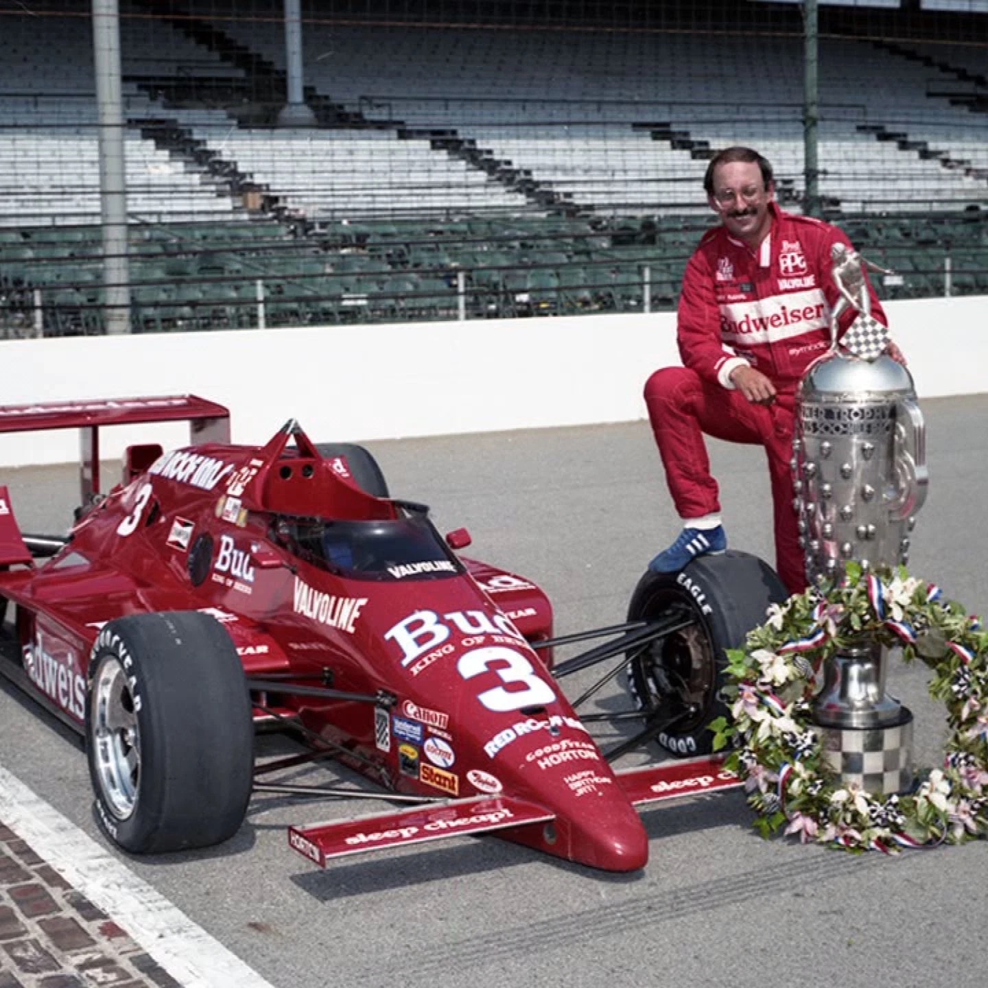 Bobby Rahal with the number 3 Budweiser IndyCar and the Indianapolis 500 trophy